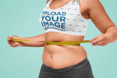 Sports Bra Mockup of a Woman Taking Measures of Her Waist