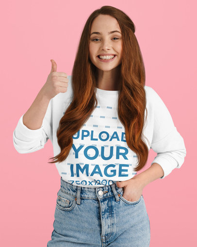 Sweatshirt Mockup of a Young Happy Woman at a Studio Giving a Thumbs Up