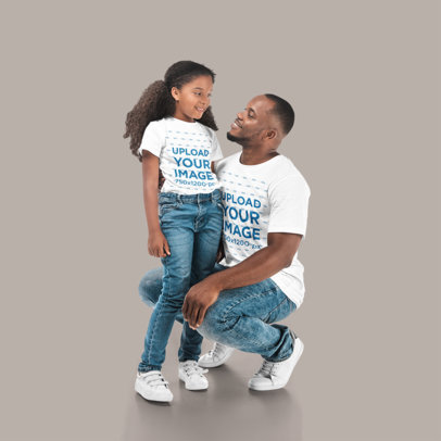 T-Shirt Mockup Featuring a Father and Daughter Smiling at Each Other