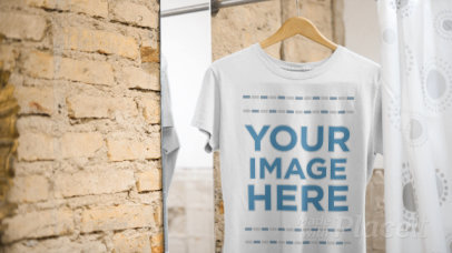Round Neck Tee Video Mockup Hanging in a Changing Room