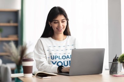 Sweatshirt Mockup of a Happy Young Woman Working From Home