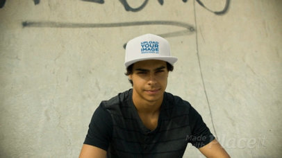Young Biker Dude Wearing a Snapback Hat Video MockupWhile Hanging out in the Skatepark a14192