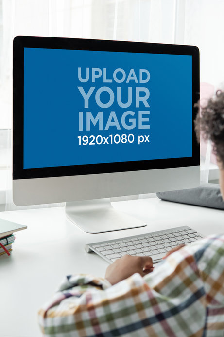 Mockup of a Kid Using an iMac at Home