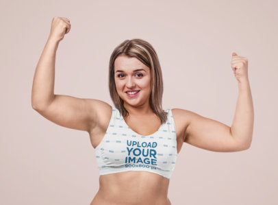 Sports Bra Mockup of a Happy Woman Showing Her Biceps