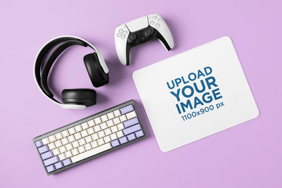 Mockup of a Mousepad Placed Next to a Gaming Controller a Retro Keyboard