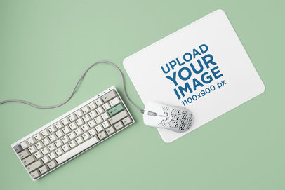 Mouse Pad Mockup Placed Over a Colorful Surface with a Keyboard and a Mouse m23223