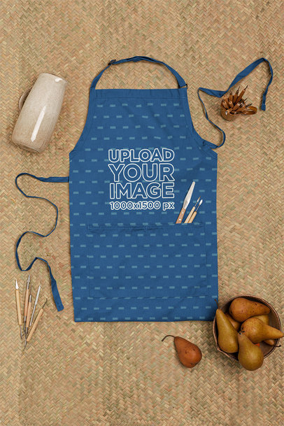 Mockup of an Apron Surrounded by Pottery ToolsMockup of an Apron Surrounded by Pottery Tools