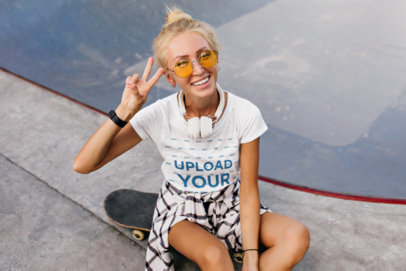 Heathered T-Shirt Mockup of Happy Woman Sitting on a Skateboard