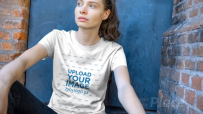 Beautiful Woman Sitting Outside Her House Wearing a Short Sleeved T-Shirt Video