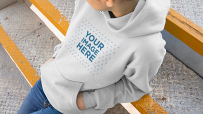 Woman Sitting On Industrial Stairs Wearing A Pullover Hoodie Video Mockup