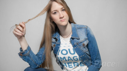 Lovely Girl Twirling her Hair while Wearing a T-Shirt Cinemagraph Mockup a13301
