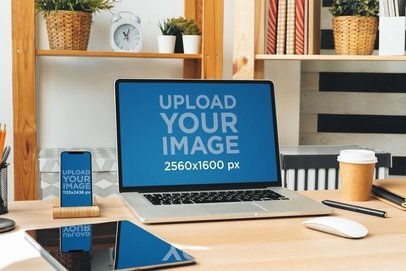 Mockup of a MacBook and iPhone 13 Placed on an Office Desk