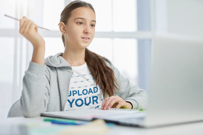 T-Shirt Mockup of a Teenage Girl Working on Her Homework