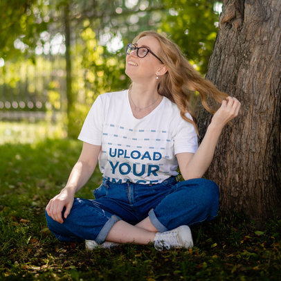 Oversized T-Shirt Mockup of a Young Woman Sitting Under a Tree m23491-r-el2