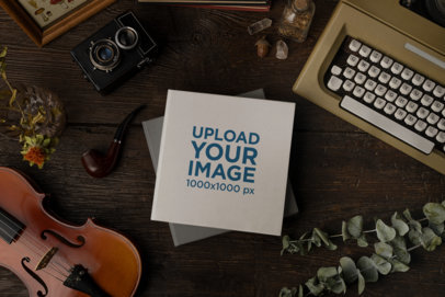 Mockup of a Book Placed over a Dark Academia Set Background m23704