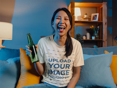 Crewneck Tee Mockup of a Happy Woman Having a Beer in Her Living Room