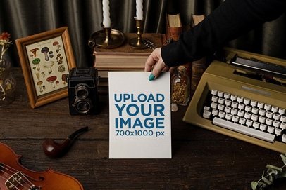 Mockup of a Woman Holding a Flyer Featuring a Dark Academia Aesthetic