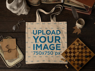 Mockup of a Tote Bag Lying on a Wooden Table Featuring Antique Stuff m23738
