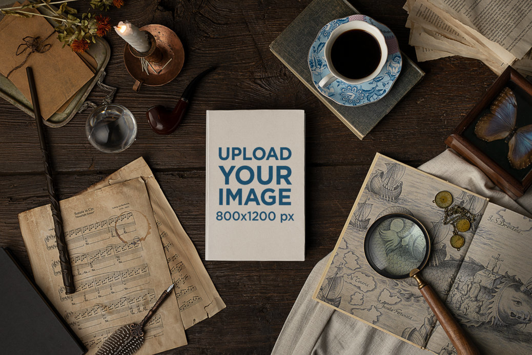 Dark Academia-Themed Mockup of a Hard Cover Book on a Wooden Table