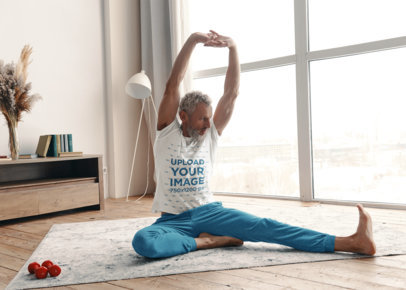 T-Shirt Mockup Featuring an Elderly Man Stretching at Home