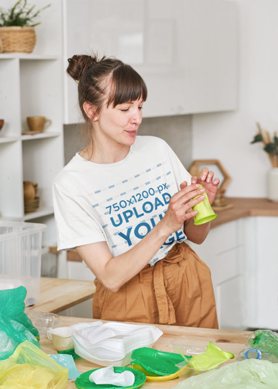 T-Shirt Mockup of a Young Woman Recycling Plastic