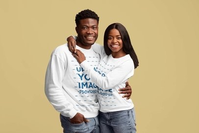 Sweatshirt Mockup of a Smiling Couple Hugging in a Studio