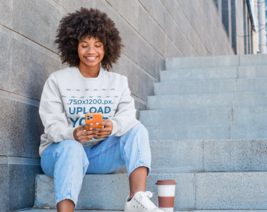 Sweatshirt Mockup of a Happy Woman Sitting on a Staircase While Texting m12624 r-el2