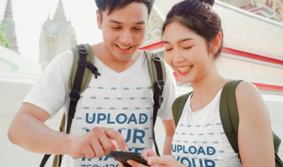 V-Neck Tee and Tank Top Mockup Featuring a Happy Couple of Tourists