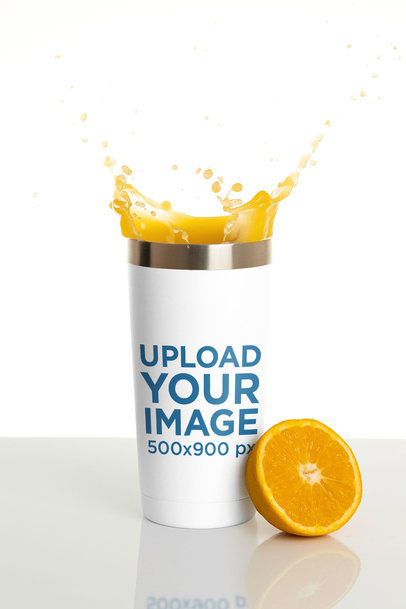 Travel Mug Mockup Featuring an Orange Slice and Splashing Juice m24320