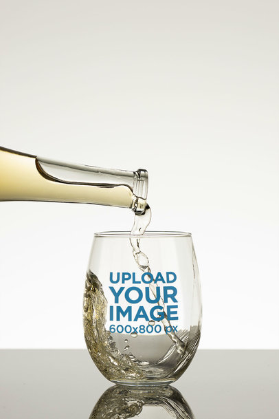 Mockup of a Glass Featuring White Wine Being Poured Into