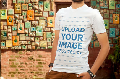 V-Neck T-Shirt Mockup Featuring a Man Posing by a Wall with Artful Tiles 5329 el1
