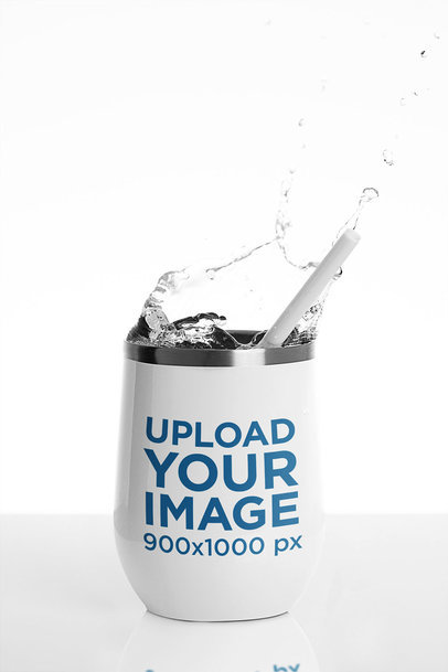 Mockup of a Wine Tumbler with a Splashing Drink m24331