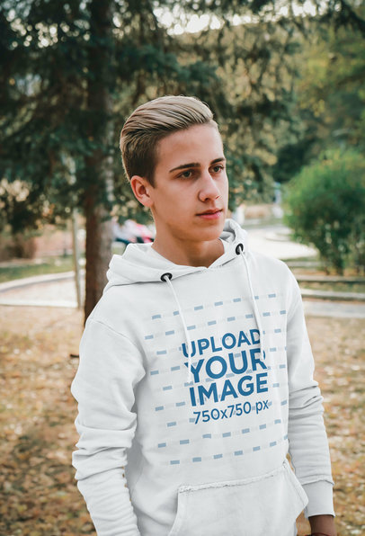 Hoodie Mockup of a Young Man With Dyed Hair Posing at a Park m21434-r-el2