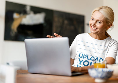 T-Shirt Mockup of a Middle-Aged Woman Doing Making a Video Call