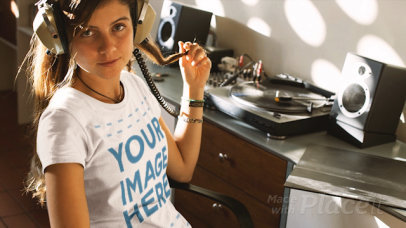 Woman Listening to a Vinyl Record Wearing a Round Neck T-Shirt Cinemagraph Mockup