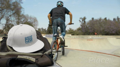 Biker Boy in a Skatepark Leaving His Snapback Hat Video Mockup on His Backpack a14195