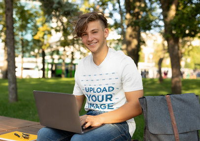 V-Neck Tee Mockup of a Young College Student Working On His Computer m20483-r-el2