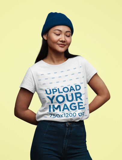 T-Shirt Mockup of a Woman Posing with Eyes Closed and Her Hands Behind Her Back