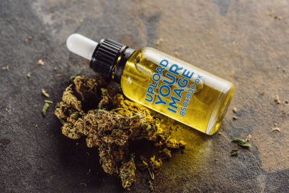 Mockup of a Dropper Bottle Featuring a Cannabis Bud