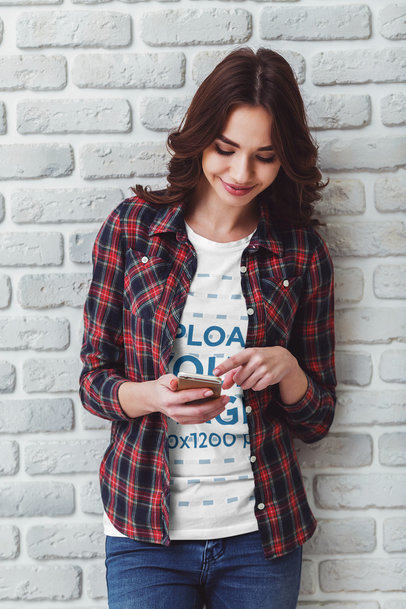 T-Shirt Mockup of a Young Woman Wearing a Plaid Shirt While Using Her Smartphone M22517-r-el2