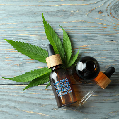 Mockup of an Amber Dropper Bottle with a Cannabis Leaf