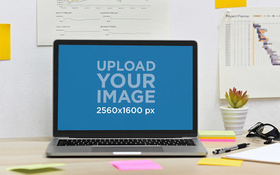 Mockup of a Macbook Placed on a Desk With Sticky Notes Around It M14906-r-el2