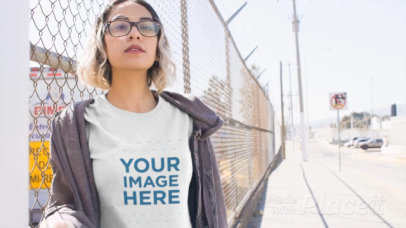 Short Haired Girl Walking Near a Fence Wearing a T-Shirt Video a13462