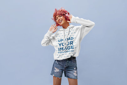 Hoodie Mockup of a Woman Listening to Music and Singing