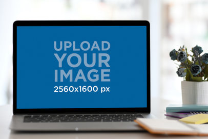 Mockup of a MacBook Air Placed on a Desk