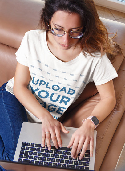 T-Shirt Mockup of a Young Woman Working in Her Living Room m16521-r-el2