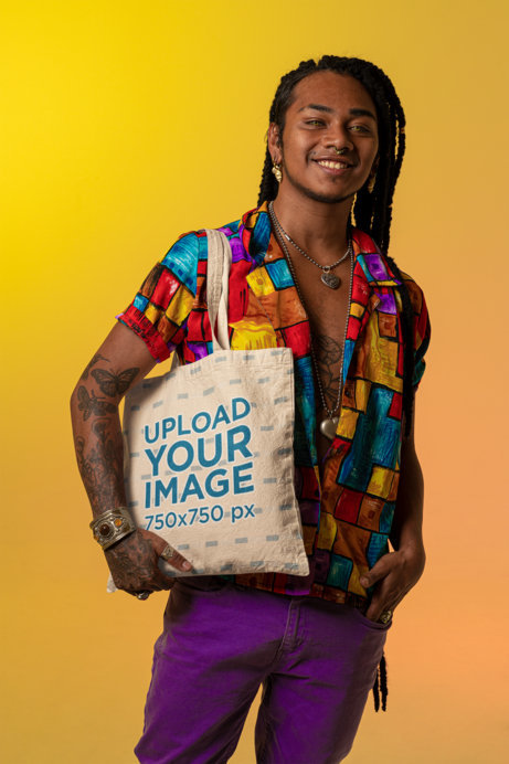 Mockup of a Tote Bag Featuring a Happy Person with Tattoos and a Heart-Shaped Necklace