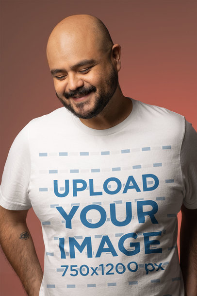 T-Shirt Mockup Featuring a Man Smiling Against a Colorful Back Setting