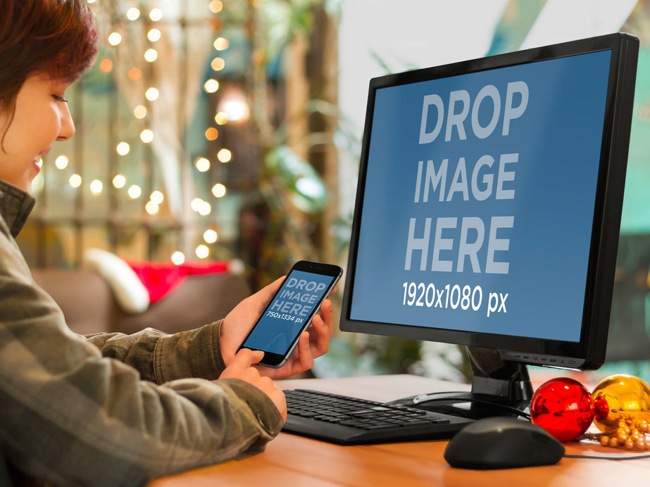 Mockup of an iPhone 6 and a PC on a Desk with Christmas Decor
