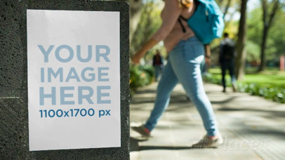 Flyer Video Mockup Glued To a Concrete Wall in a University